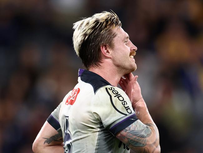 SYDNEY, AUSTRALIA - SEPTEMBER 01:  Cameron Munster of the Storm reacts after missing a goal during the round 25 NRL match between the Parramatta Eels and the Melbourne Storm at CommBank Stadium on September 01, 2022, in Sydney, Australia. (Photo by Cameron Spencer/Getty Images)