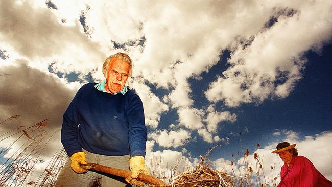 Harry Elliffe cleans up lagoon. Picture: Joe Murphy