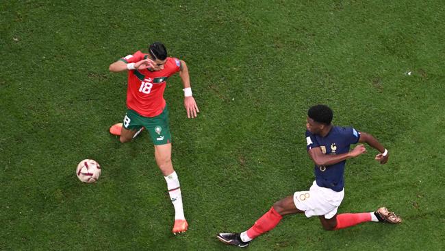 France's midfielder #08 Aurelien Tchouameni and Morocco's defender #18 Jawad El Yamiq