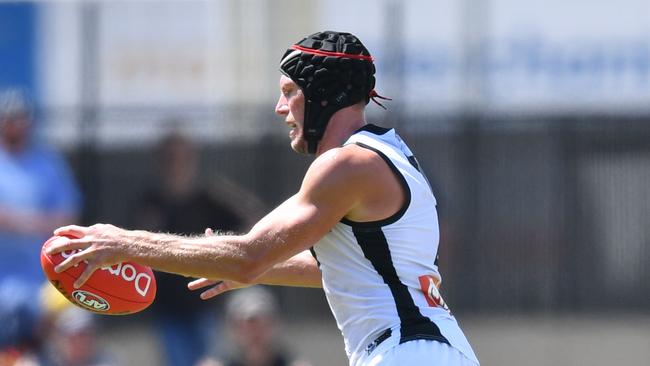 Brad Ebert gets a kick away during a Port Adelaide trial match.