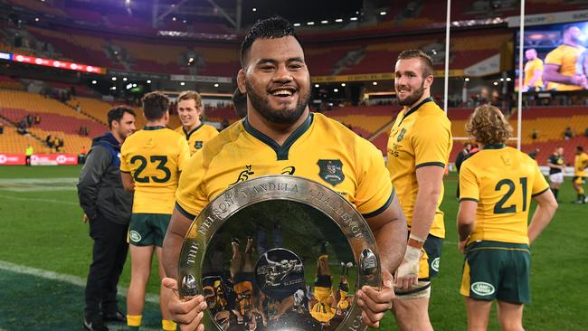 Taniela Tupou holds the Mandela Plate following the win over South Africa. (AAP Image/Dave Hunt)