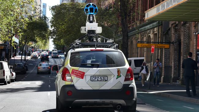 A Google street view car travels with a camera mounted on the roof capturing images to add to Google maps.