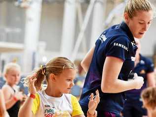 ON COURT: Jacqui Russell and Willow Perkins, 6, at a Lightning clinic at Caloundra. Picture: Patrick Woods