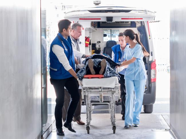 Doctors and paramedics attending an emergency arriving at the hospital in an ambulance. Picture: Istock