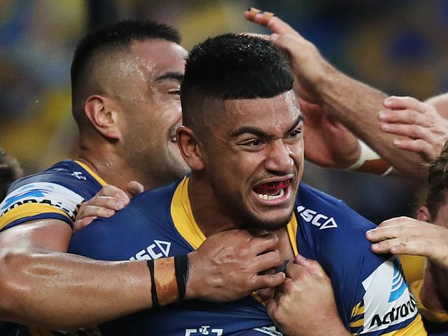 Parramatta players celebrate a try by Parramatta's Oregon Kaufusi during the Parramatta v Wests Tigers NRL match at the new Bankwest Stadium, Parramatta. Picture: Brett Costello