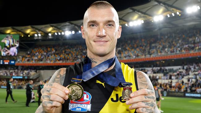 BRISBANE, AUSTRALIA - OCTOBER 24: Dustin Martin of the Tigers celebrates with his Norm Smith Medal and Premiership Medal during the 2020 Toyota AFL Grand Final match between the Richmond Tigers and the Geelong Cats at The Gabba on October 24, 2020 in Brisbane, Australia. (Photo by Michael Willson/AFL Photos via Getty Images)