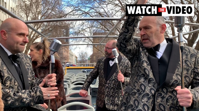 Tassie act CROON performs atop the city's double-decker bus