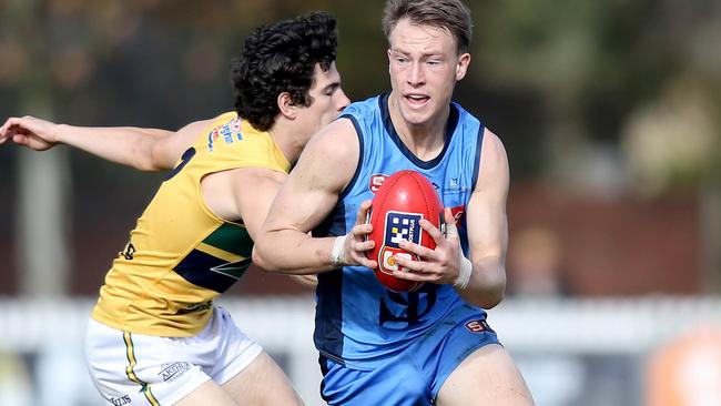 Sturt’s Mani Liddy evades the tackle of Eagle Jake Comitogianni at Unley Oval on Saturday. Picture: Dean Martin.