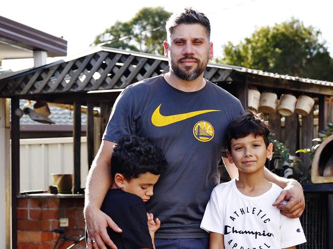 DAILY TELEGRAPH - 8.6.24MUST CHECK WITH PIC EDITOR BEOFRE USE - A home is destroyed in Whalan last week after a massive explosion. Milan Mikac  and kids Lucas (right) and Jacob (left) pictured in his home which suffered extensive damage due to the force of the blast. Picture: Sam Ruttyn