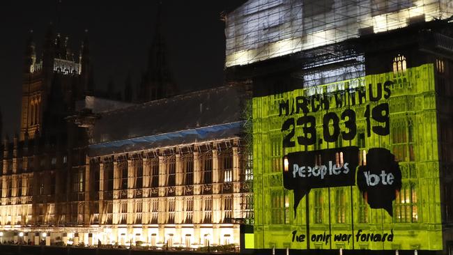 A projection calling for a second referendum is cast onto the Houses of Parliament in London. Picture: AP.