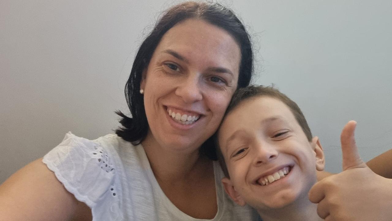 Harry Sammut, 10, with mum Julia, has begun treatment in the US. Picture: Supplied