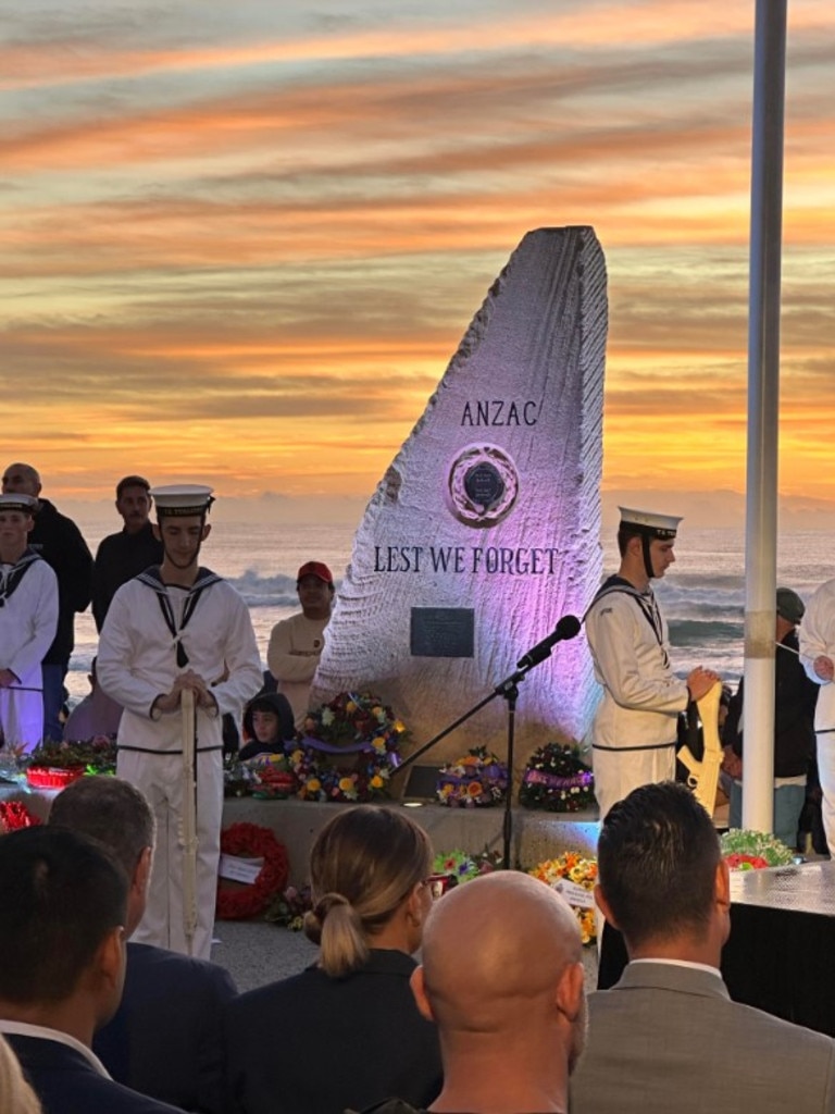 The Last Post - by bugler Dr Richard Thompson of the Gold Coast City Brass Band - rang out in the cool morning air as the crowd listened on in stoic silence. Surfers Paradise. Photo: Ryan Keen