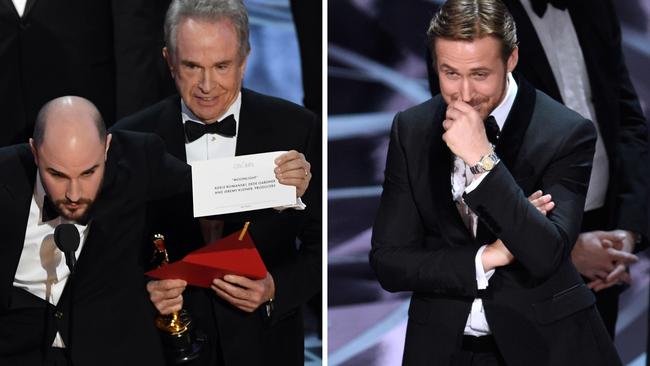 Oscars 2017 .. 'La La Land' producer Jordan Horowitz holds up the winner card reading actual Best Picture winner 'Moonlight' with actor Warren Beatty onstage during the 89th Annual Academy Awards. Picture: Getty