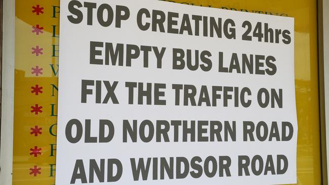 A protest sign hangs in a window of a store on Old Northern Road in Baulkham.Hills today, November 1, 2018. (AAP Image/David Swift)