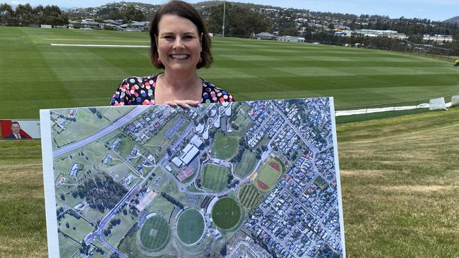 Kingborough Mayor Paula Wriedt with an aerial view of an expanded Twi Ovals precinct to accommodate an AFL High Performance Centre. Picture James Bresnehan.