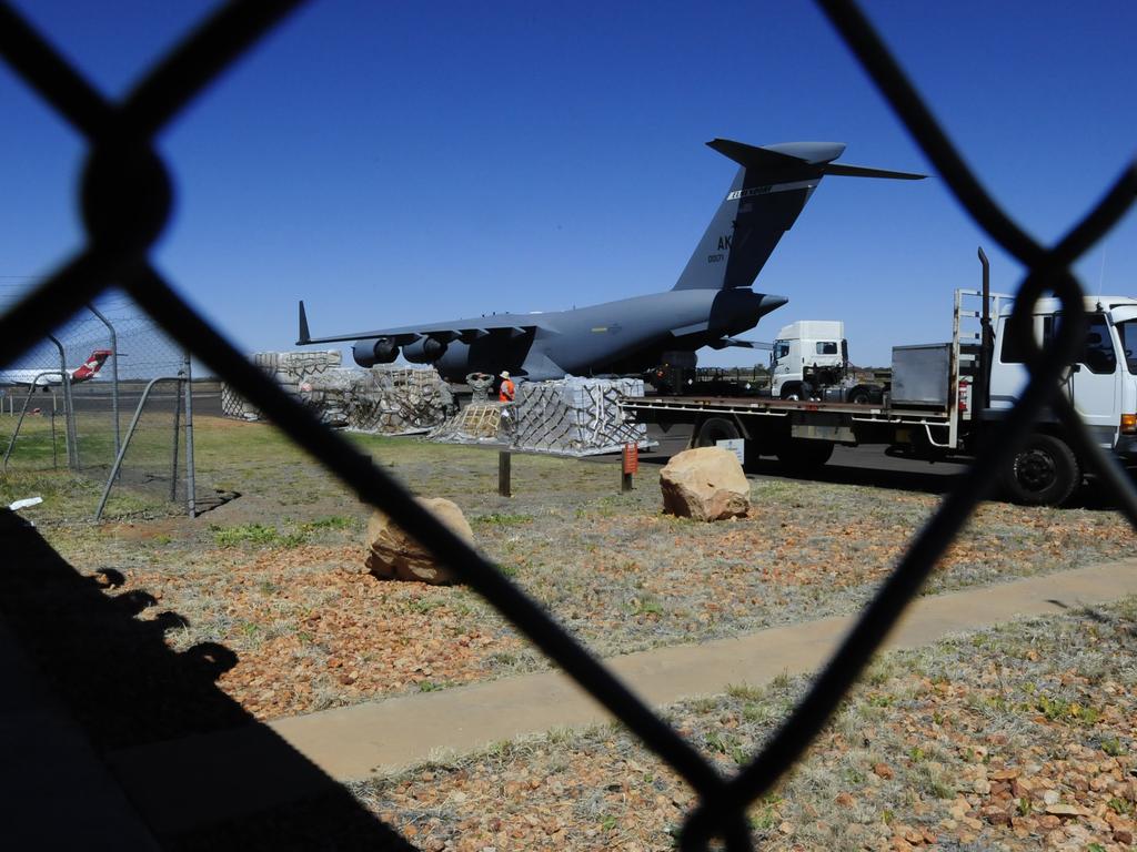 A US Air Force plane at Alice Springs Airport, being loaded with materials from Pine Gap.