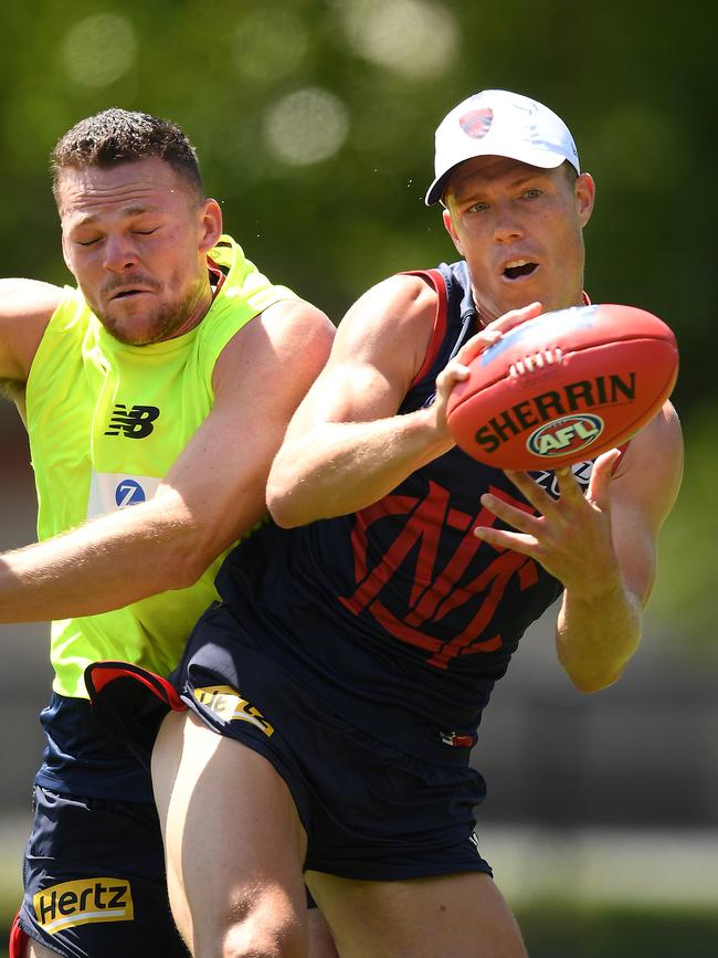 Jake Melksham of the Demons marks infront of Steven May during a training session. Picture: Getty Images