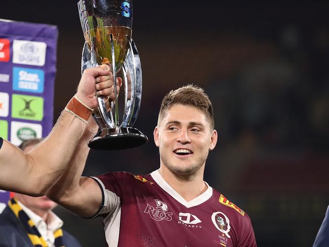 BRISBANE, AUSTRALIA - MAY 08: Liam Wright and James O'Connor of the Reds hold the trophy after winning the Super RugbyAU Final match between the Queensland Reds and the ACT Brumbies at Suncorp Stadium, on May 08, 2021, in Brisbane, Australia. (Photo by Jono Searle/Getty Images)