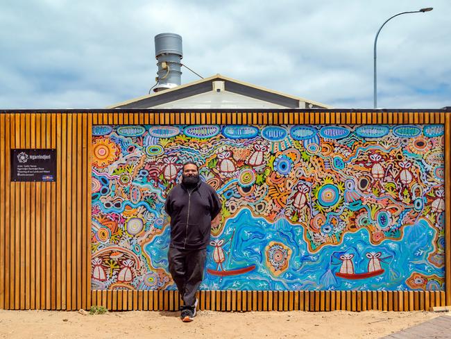 Artist Cedric Varcoe in front of his artwork at Kuti Shack Photo: Goolwa Pipi Co and Kuti Co