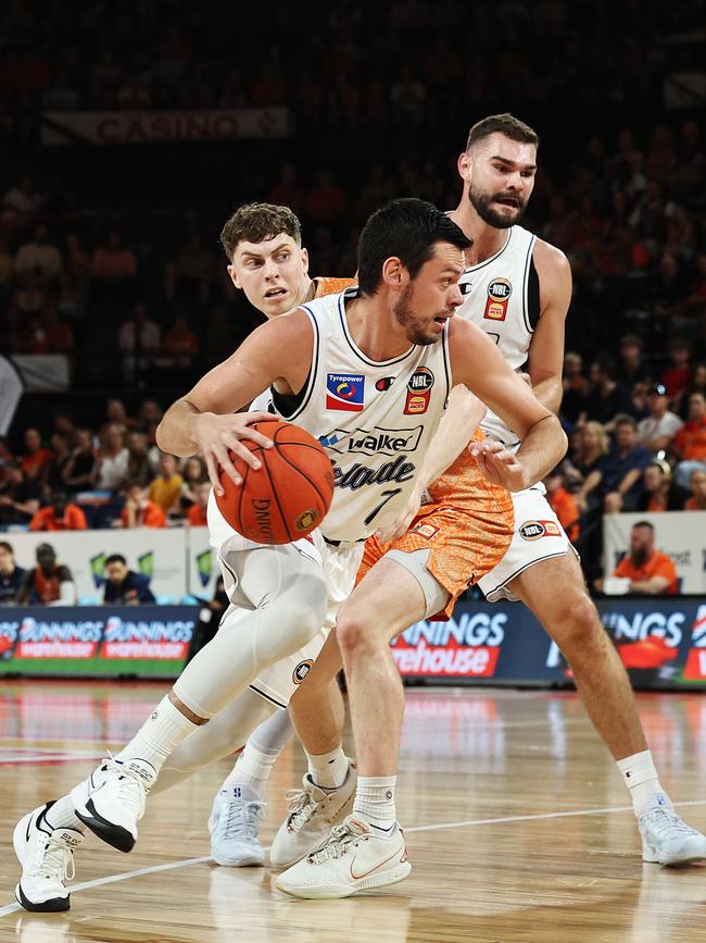 Adelaide's Jason Cadee gets past Jonah Antonio in the National Basketball League (NBL) match between the Cairns Taipans and the Adelaide 36ers, held at the Cairns Convention Centre. Picture: Brendan Radke