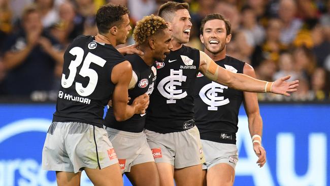 (From left) Ed Curnow, Jarrod Garlett, Marc Murphy and Jed Lamb celebrate a goal.