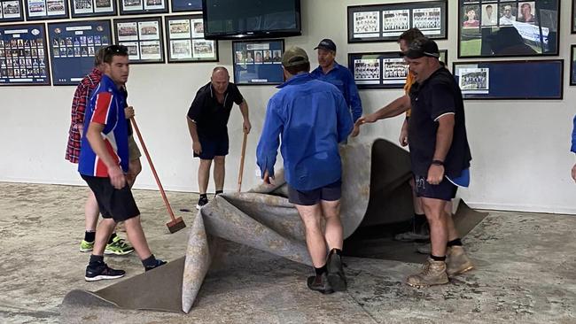 Avoca Football Club helpers rip up the carpet. Picture: Avoca Football Club.