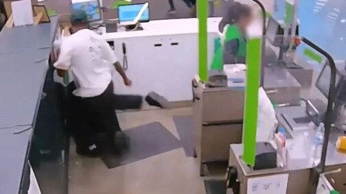 A male customer kicks a Woolies team member inside the service desk in Parramatta. Picture: Supplied