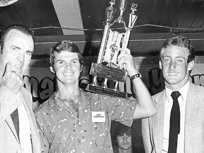 Champion diver Greg Robertson holds his 1982 Sports star of the year trophy with Bob Simpson (former Australian cricket captain) and Mick Porra (surf life saving).