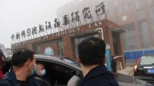 Members of the World Health Organisation (WHO) team investigating the origins of the COVID-19 coronavirus arrive by car at the Wuhan Institute of Virology in Wuhan in China's central Hubei province on February 3, 2021. (Photo by HECTOR RETAMAL / AFP)