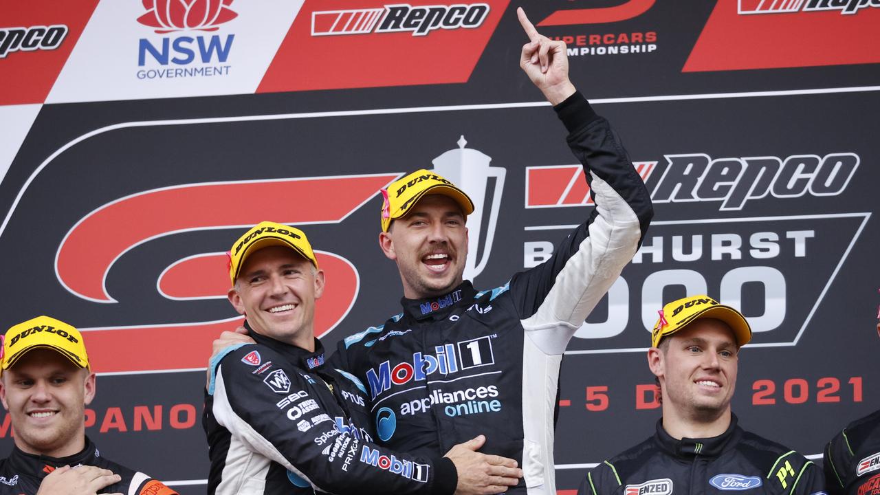 DAILY TELEGRAPH. DECEMBER 5, 2021. Pictured is Lee Holdsworth and Chaz Mostert celebrating on the podium after winning the Repco Bathurst 1000 at Mount Panorama today. Picture: Tim Hunter.