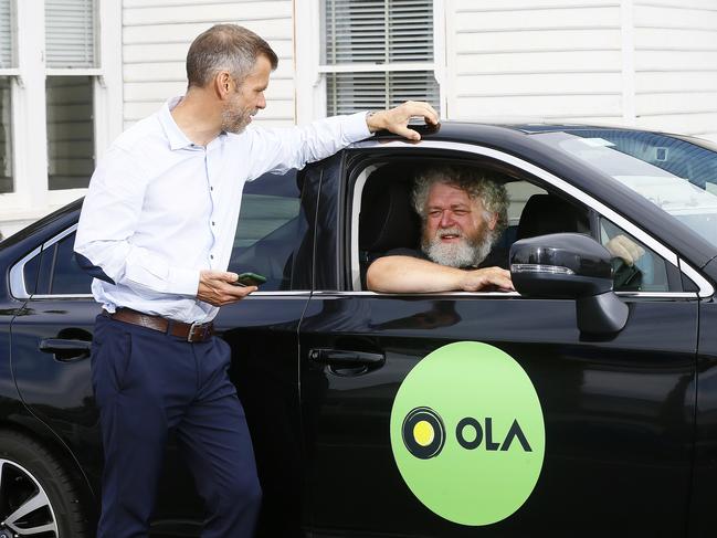 Ola managing director, Simon Smith, chats to new rideshare driver, Scott Greene. Picture: Matt Thompson