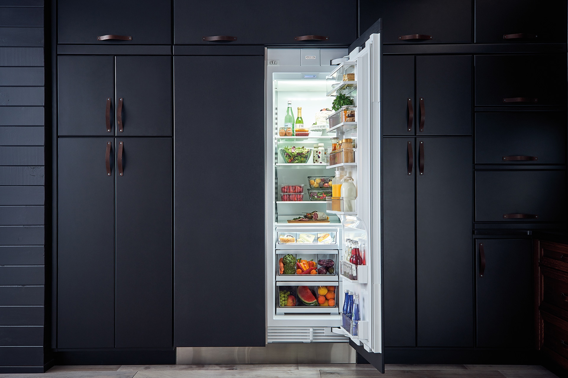 kitchen fridge next to wall