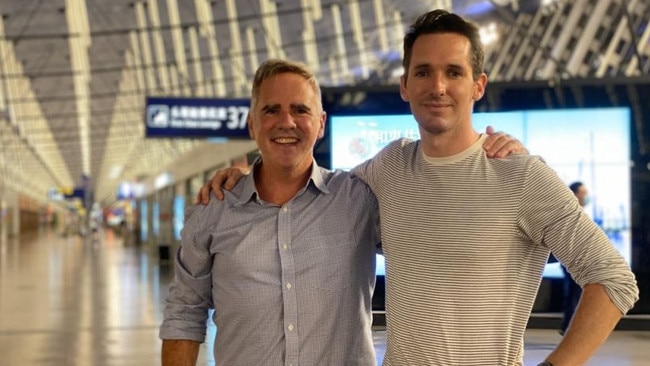 The Australian Financial Review's Michael Smith (left) and the ABC's Bill Birtles flew out of Shanghai on Monday night.