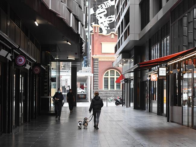 MELBOURNE, AUSTRALIA - JULY 27: Empty streets of the city are seen on July 27, 2020 in Melbourne, Australia. Victoria has recorded 532 new cases of coronavirus and six more deaths. Metropolitan Melbourne and the Mitchell shire remain in lockdown due to the rise in COVID-19 cases through community transmissions, with people permitted to leave home only for exercise, work, to buy essential items, or to access childcare and healthcare and individuals are required Face coverings or be subject to a $200 fine. Lockdown measures are in place until August 19. (Photo by Quinn Rooney/Getty Images)