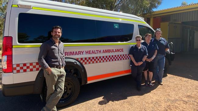 Gwoja MLA Chansey Paech and health workers with the 4wd Toyota Hiace ambulance.