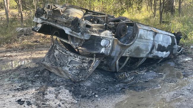 Car rolled and torched in bushland near Coomera. Picture Supplied