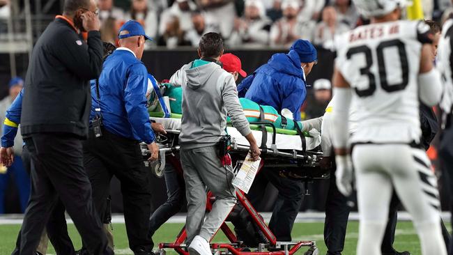 CINCINNATI, OHIO - SEPTEMBER 29: Medical staff tend to quarterback Tua Tagovailoa #1 of the Miami Dolphins as he is carted off on a stretcher after an injury during the 2nd quarter of the game against the Cincinnati Bengals at Paycor Stadium on September 29, 2022 in Cincinnati, Ohio. Dylan Buell/Getty Images/AFP