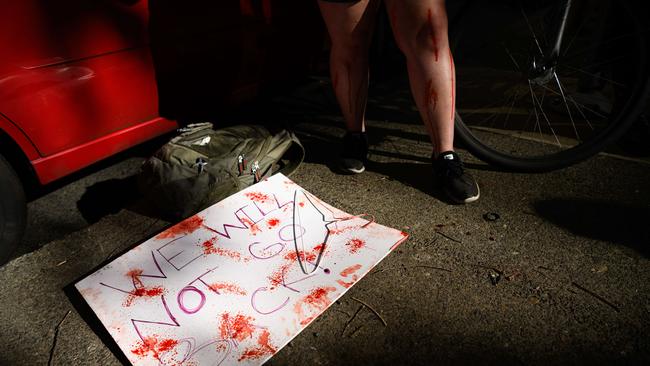 A sign covered in fake blood is seen on the ground as people gather to protest the Supreme Court's decision to overturn Roe v. Wade in Portland, Oregon. Picture: Getty