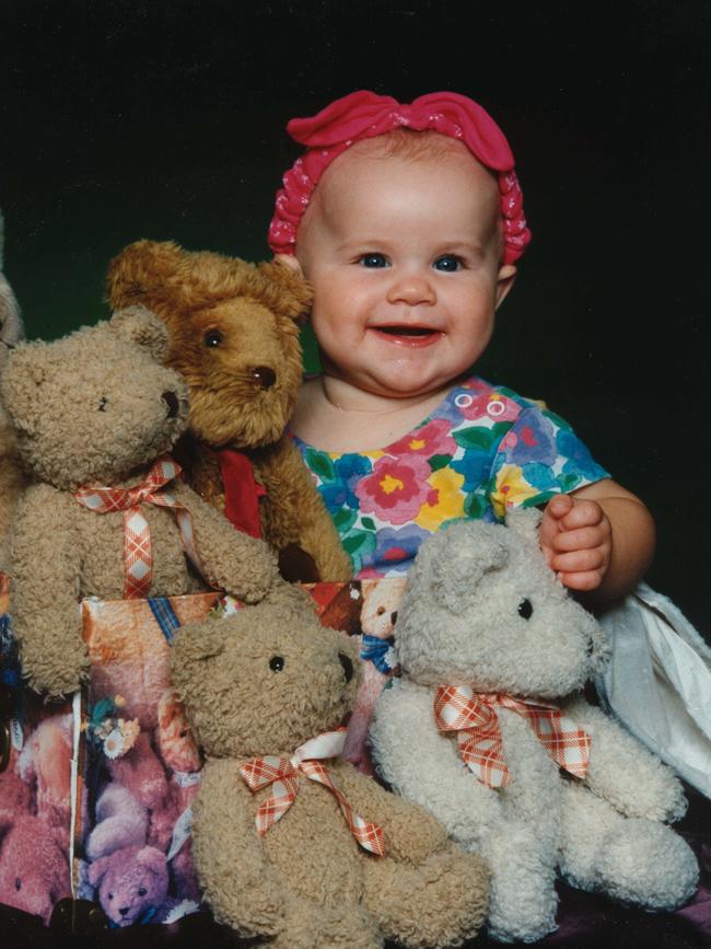 Baby Laura Folbigg with her teddy bears in an undated photo.