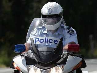 A police motorcycle officer trying to intercept a car travelling at almost 150kmh on the Bruce Highway on Sunday was pelted with tools and full bottles of drink, forcing him to give up the chase.. Picture: Barry Leddicoat