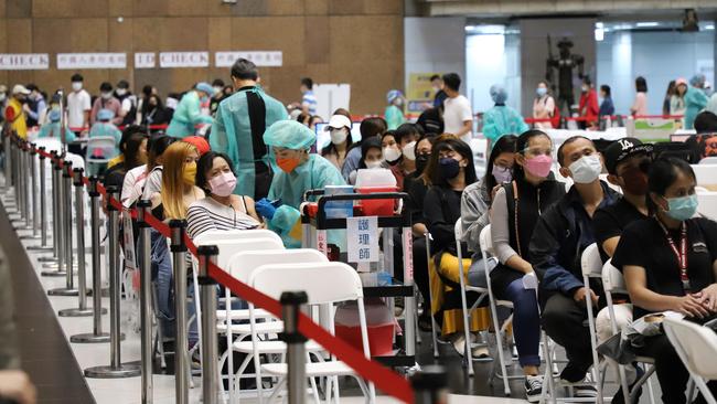 Pateitns wait for a Covid jab at a walk-in vaccine clinic.