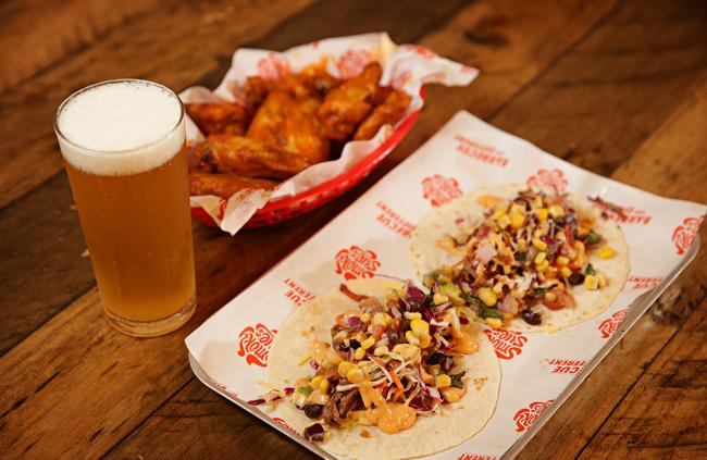 Brisket tacos and hot wings.