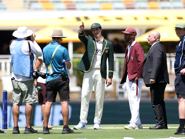 Australia's Pat Cummins is seen with Kraigg Brathwaite at the coin toss.