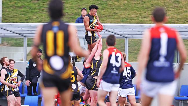 Elijah Reardon soars above the pack for a spectacular mark. Picture: ZAK SIMMONDS