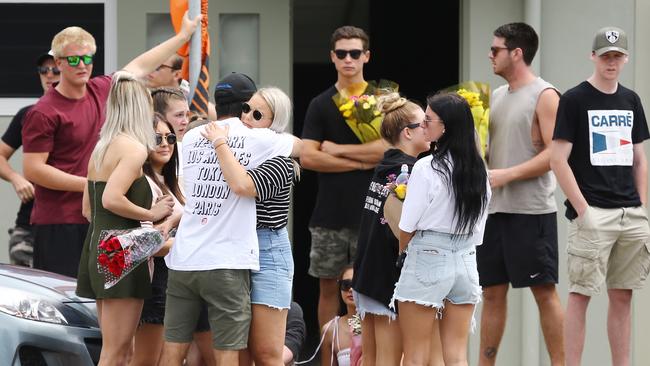 Family and friends hold a memorial for Dylan Carpenter at Fingal beach where the young surfer died. Picture: Glenn Hampson