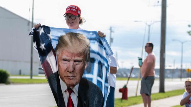 MILWAUKEE, WISCONSIN - JULY 14: Supporters of Republican presidential candidate, former U.S. President Donald await his arrival at Milwaukee Mitchell International Airport on May 10, 2024 in Milwaukee, Wisconsin. Law enforcement officials began final preparations on the eve of the Republican National Convention where Trump is expected to formally receive the GOP nomination for the 2024 U.S. Presidential election. Trump suffered minor injuries during a campaign rally on on July 13 in Butler, Pennsylvania after a gunman opened fired, killing one person and injuring two critically.   Jim Vondruska/Getty Images/AFP (Photo by Jim Vondruska / GETTY IMAGES NORTH AMERICA / Getty Images via AFP)