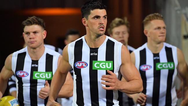 Scott Pendlebury (middle) with Taylor Adams and Adam Treloar make up Collingwood’s top midfield. Picture: Getty Images