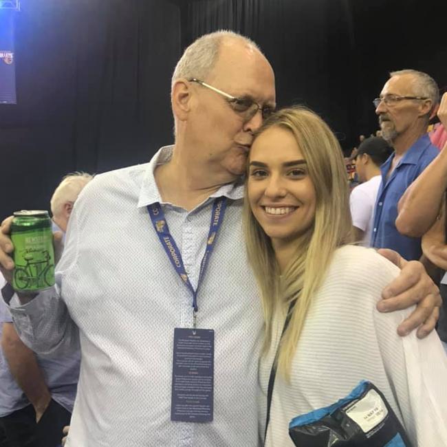 Queensland basketball identity Allan Woodford with daughter, Madie, at a Brisbane Bullets NBL game.