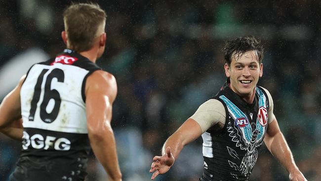 ADELAIDE, AUSTRALIA - MAY 19: Zak Butters of the Power celebrates a goal with Ollie Wines during the 2023 AFL Round 10 match between Yartapuulti/Port Adelaide Power and Narrm/Melbourne Demons at Adelaide Oval on May 19, 2023 in Adelaide, Australia. (Photo by Sarah Reed/AFL Photos via Getty Images)