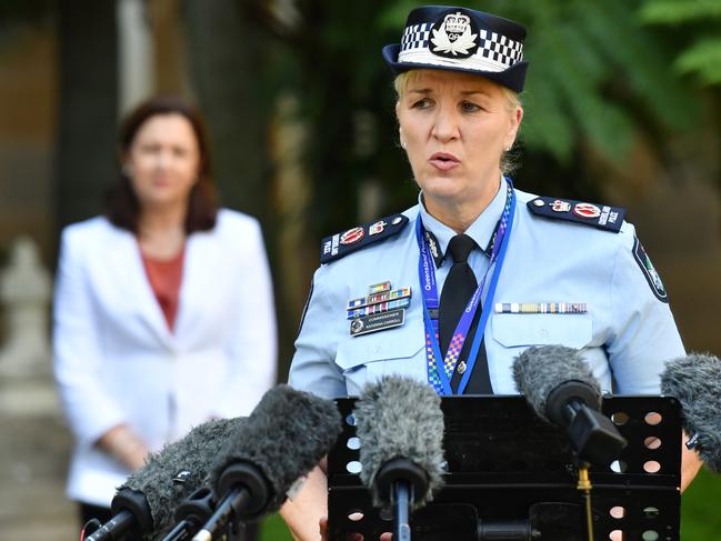 Queensland Police Commissioner Katarina Carroll (right) is seen during a press conference at Queensland Parliament House in Brisbane, Monday, March 30, 2020. Premier Palaszczuk announced that Queensland had 33 more cases of coronavirus (COVID-19), taking the state's overall number to 689 cases. (AAP Image/Darren England) NO ARCHIVING